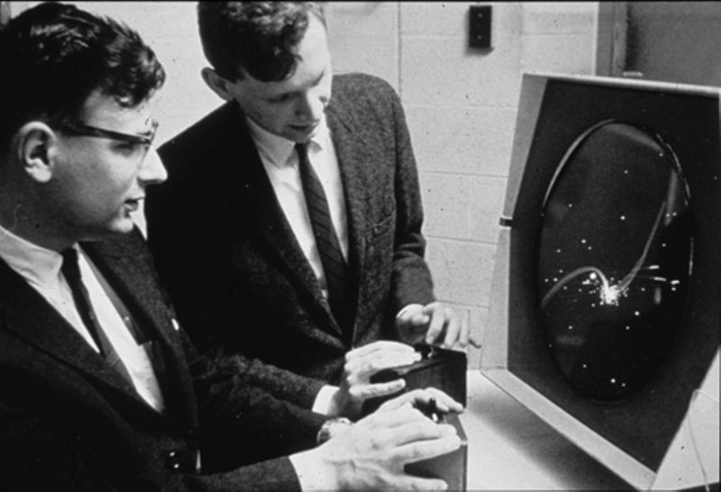 Two men playing spacewar